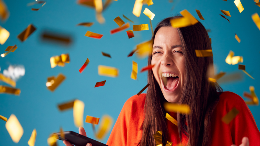 An older student is showered in gold confetti, signifying a reward earned through good behavior