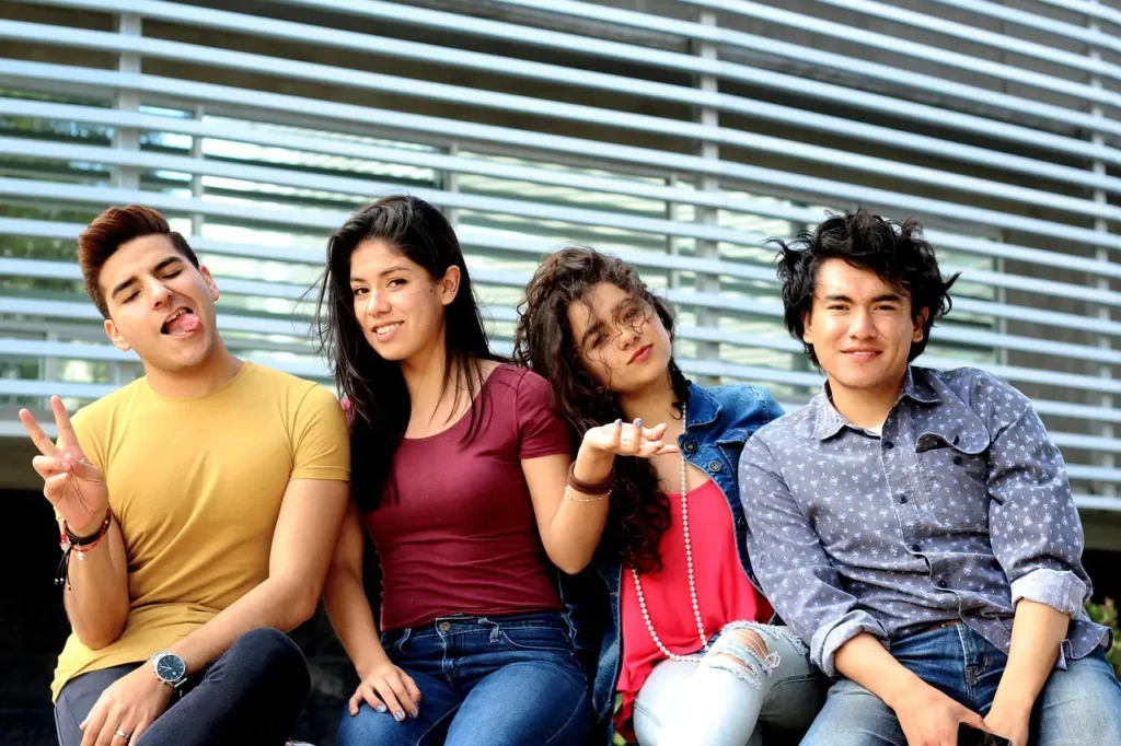Four eighth grade students sit on a couch and give attitude, indicating the need for a class meeting on respect