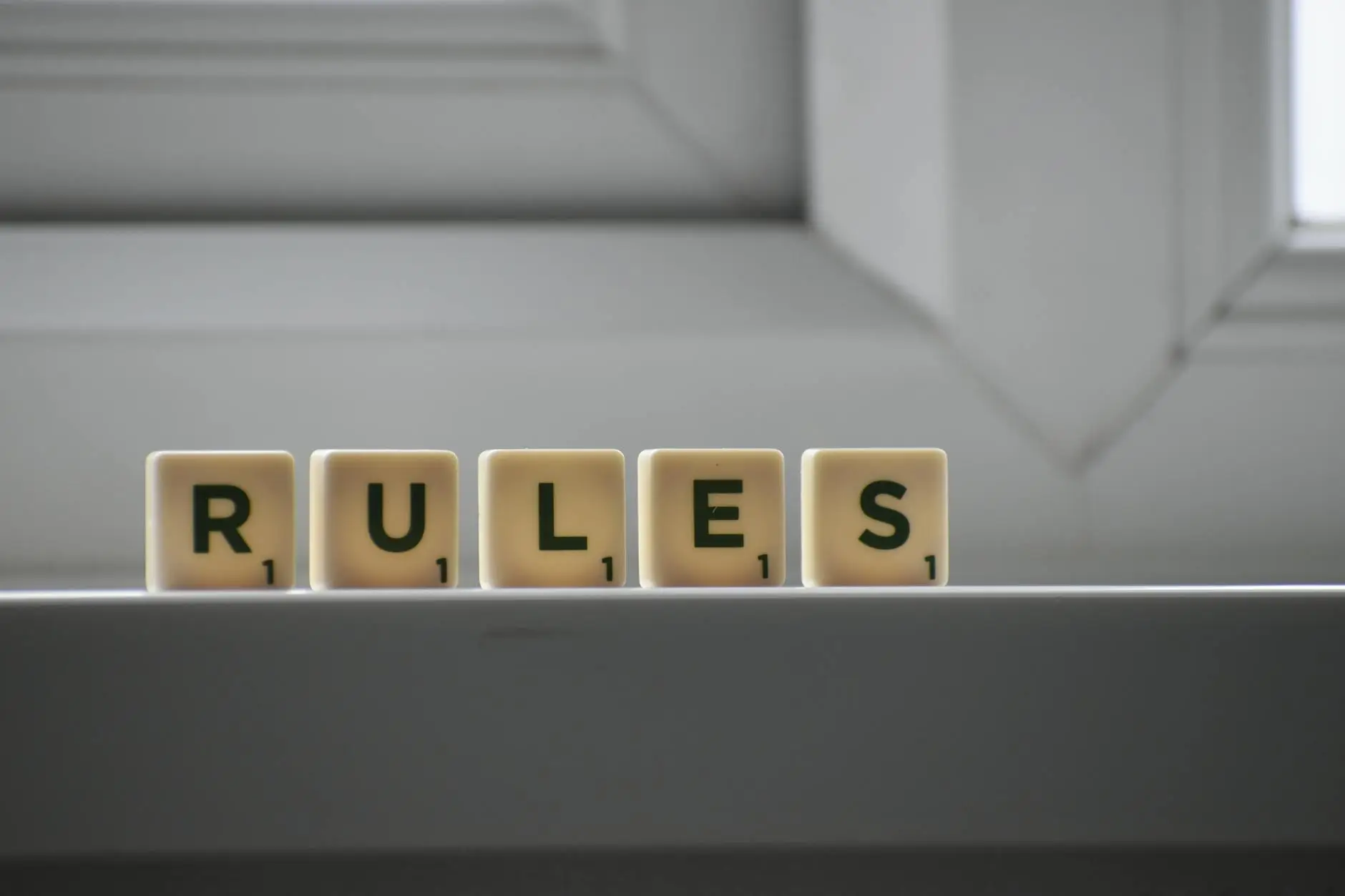 Tiles with the letters RULES on them, showing the importance of classroom rules