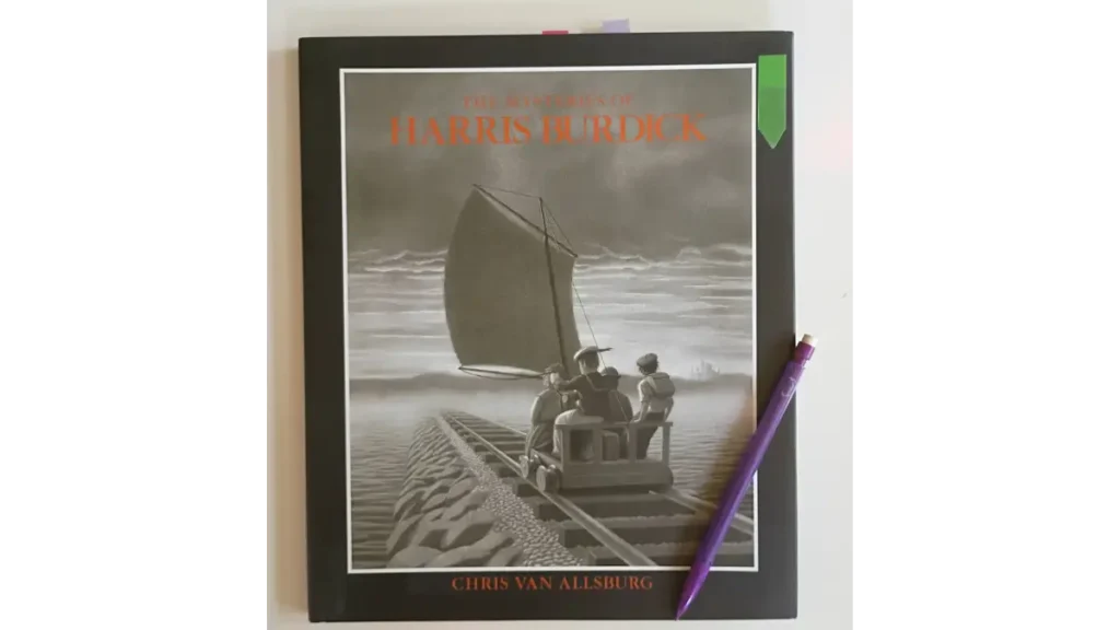 The cover of the book The Mysteries of Harris Burdick with sticky flags and a purple mechanical pencil resting on top